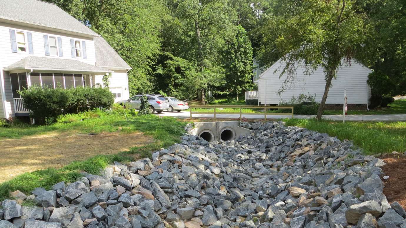 New stormwater pipes going under a driveway on Spring Drive