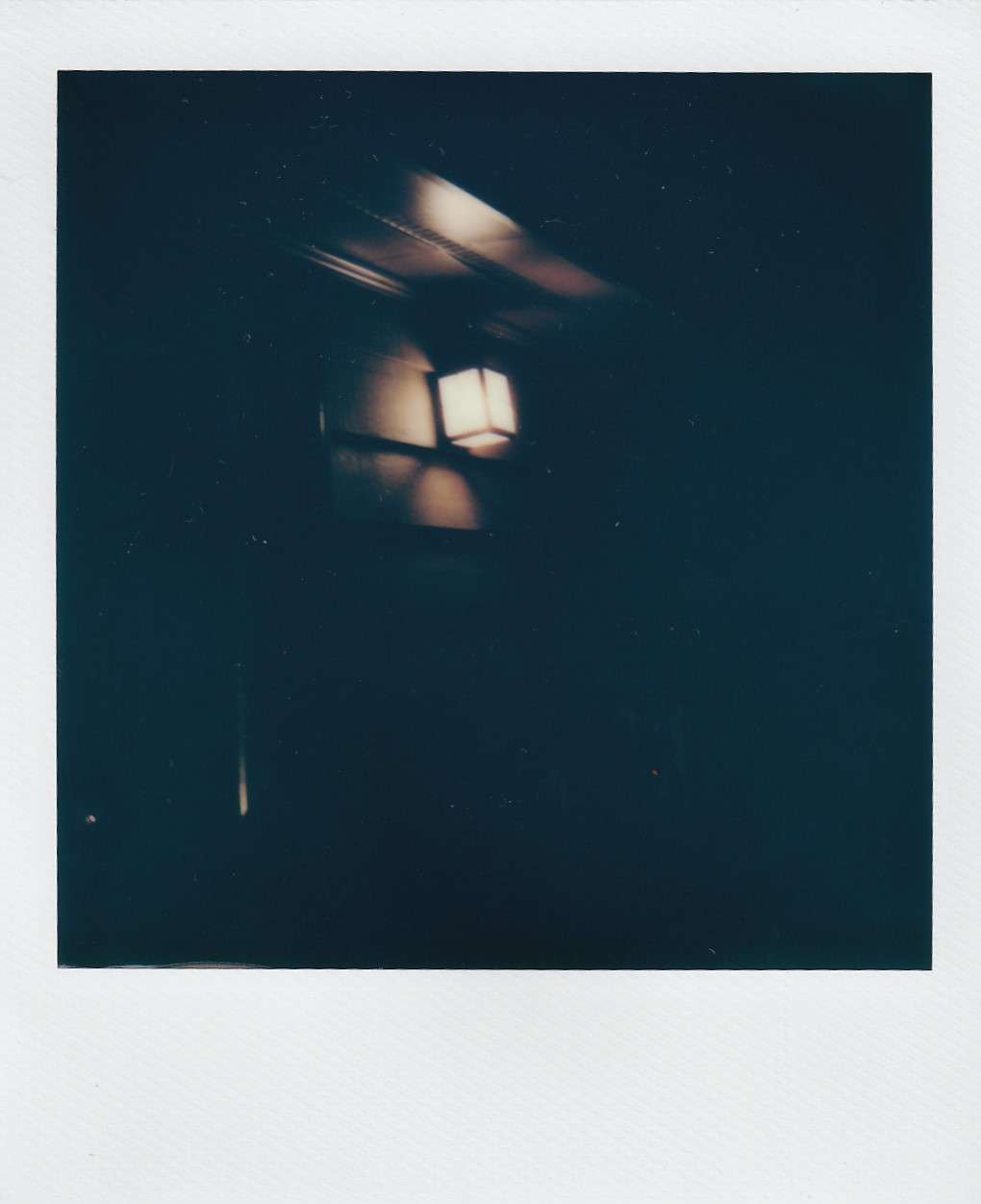 Polaroid photography by I'Nasah Crockett, front door light at night