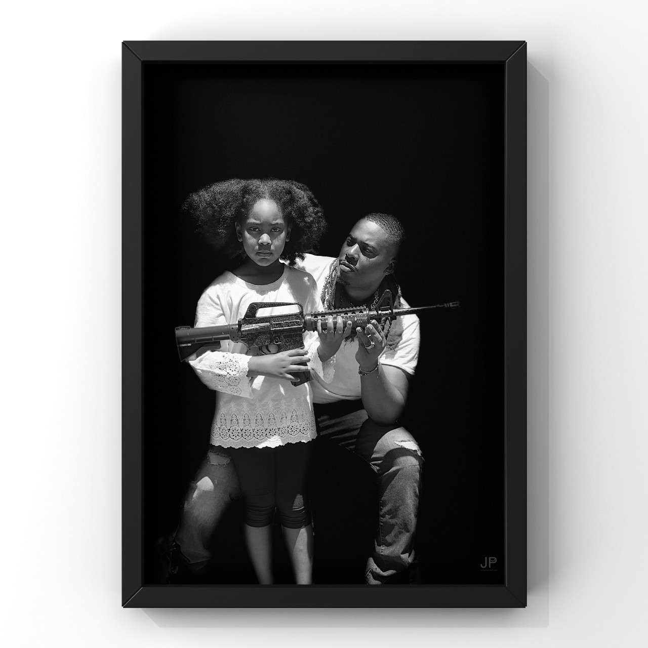 Photo on canvas by JP Jermaine Powell, a small girl holds a gun with the artist