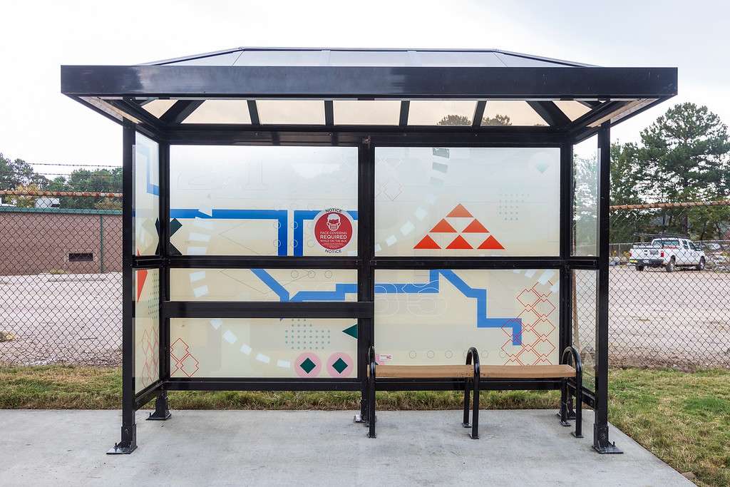 artwork by Amanda Hakanson-Stacy covering the windows of a bus shelter
