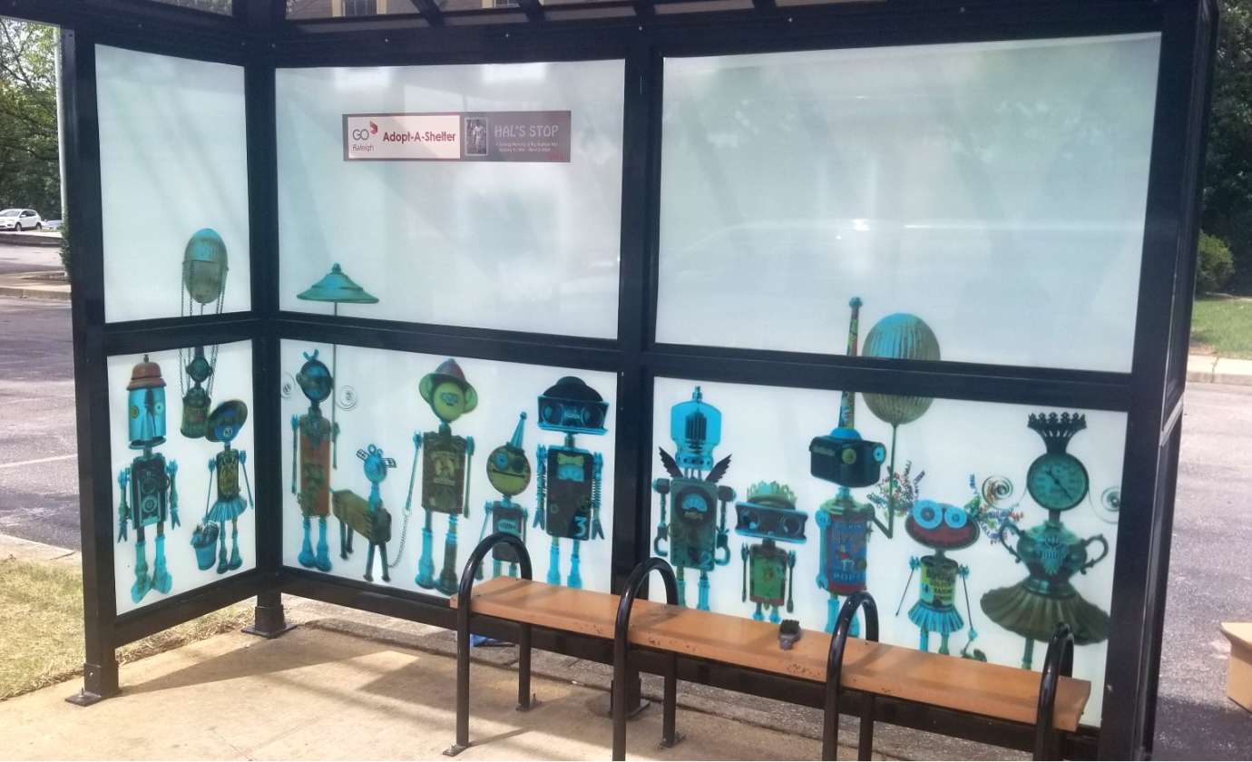 artwork by Amy Flynn covering the windows of a bus shelter
