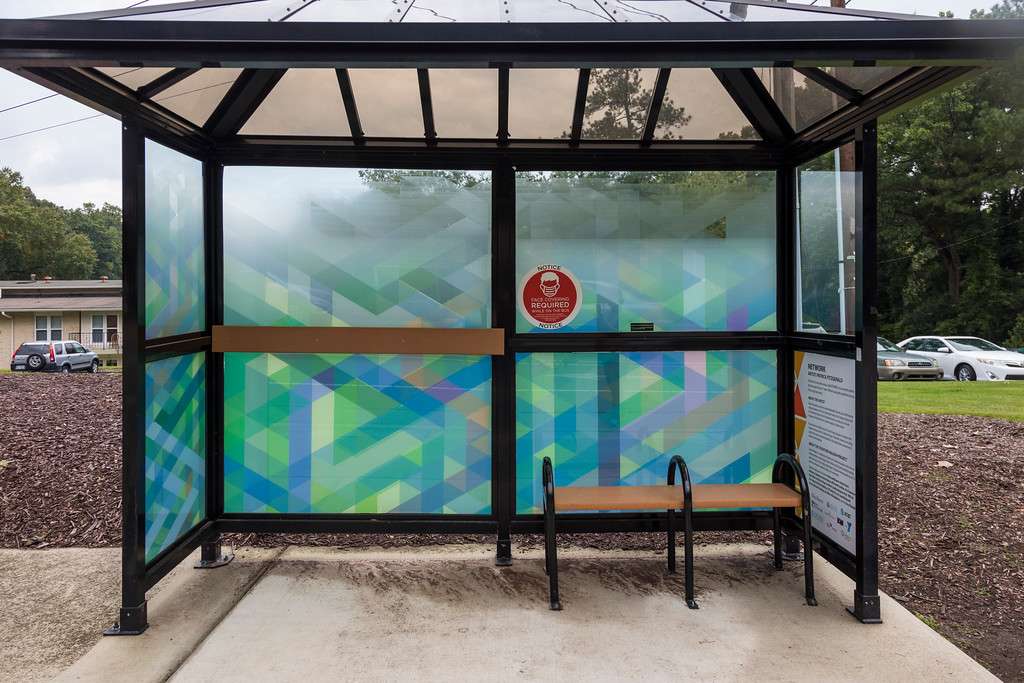 artwork by Patrick FitzGerald covering the windows of a bus shelter