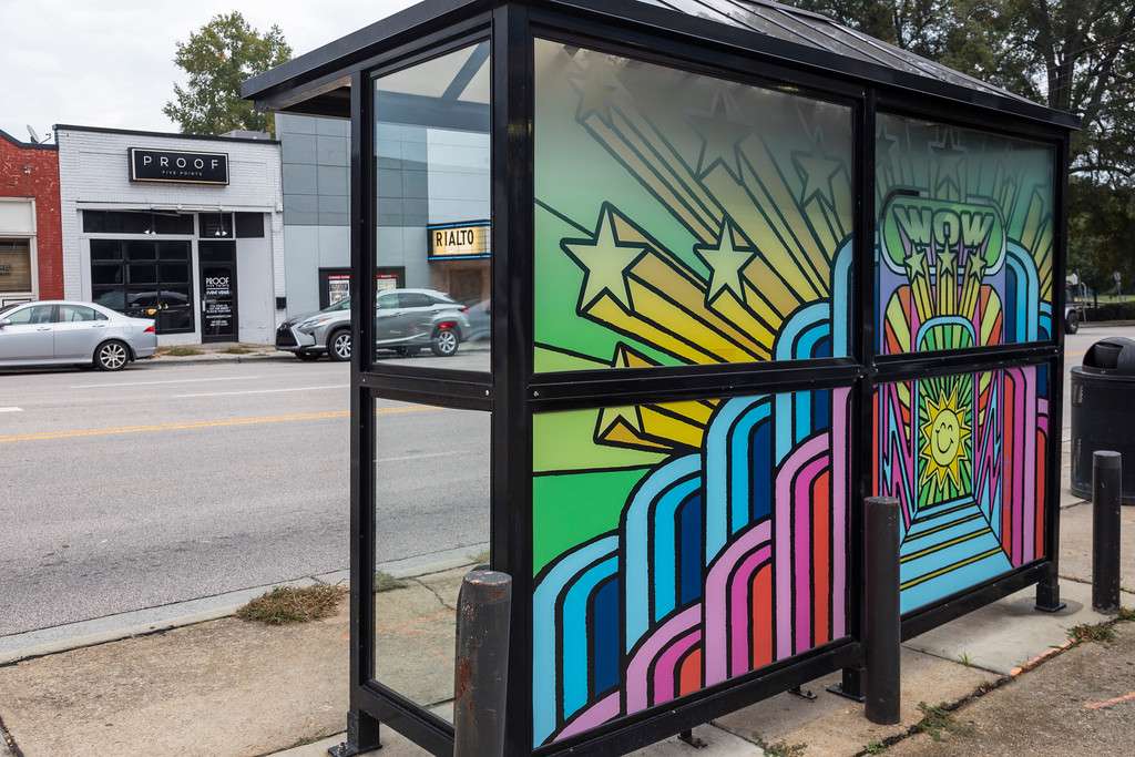artwork by Paul Friedrich covering the windows of a bus shelter