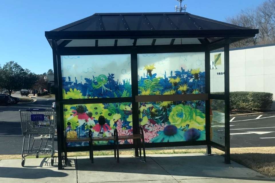 artwork by Rachel Herrick covering the windows of a bus shelter
