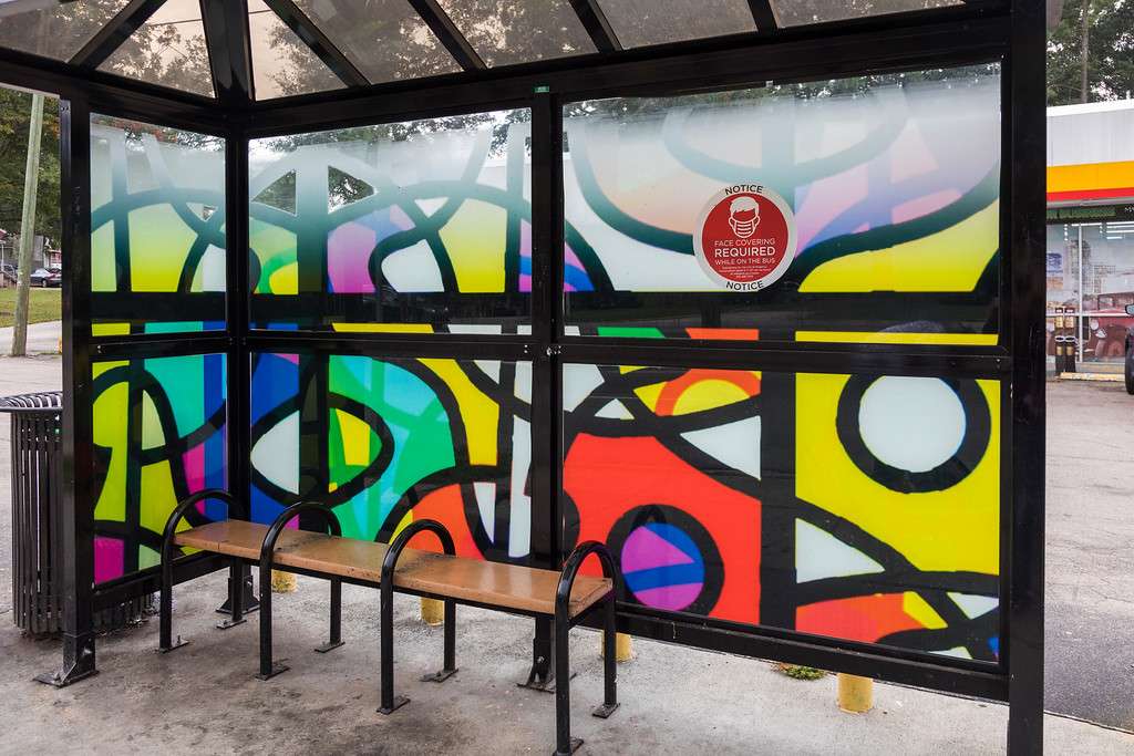 artwork by Rosa Cruz covering the windows of a bus shelter