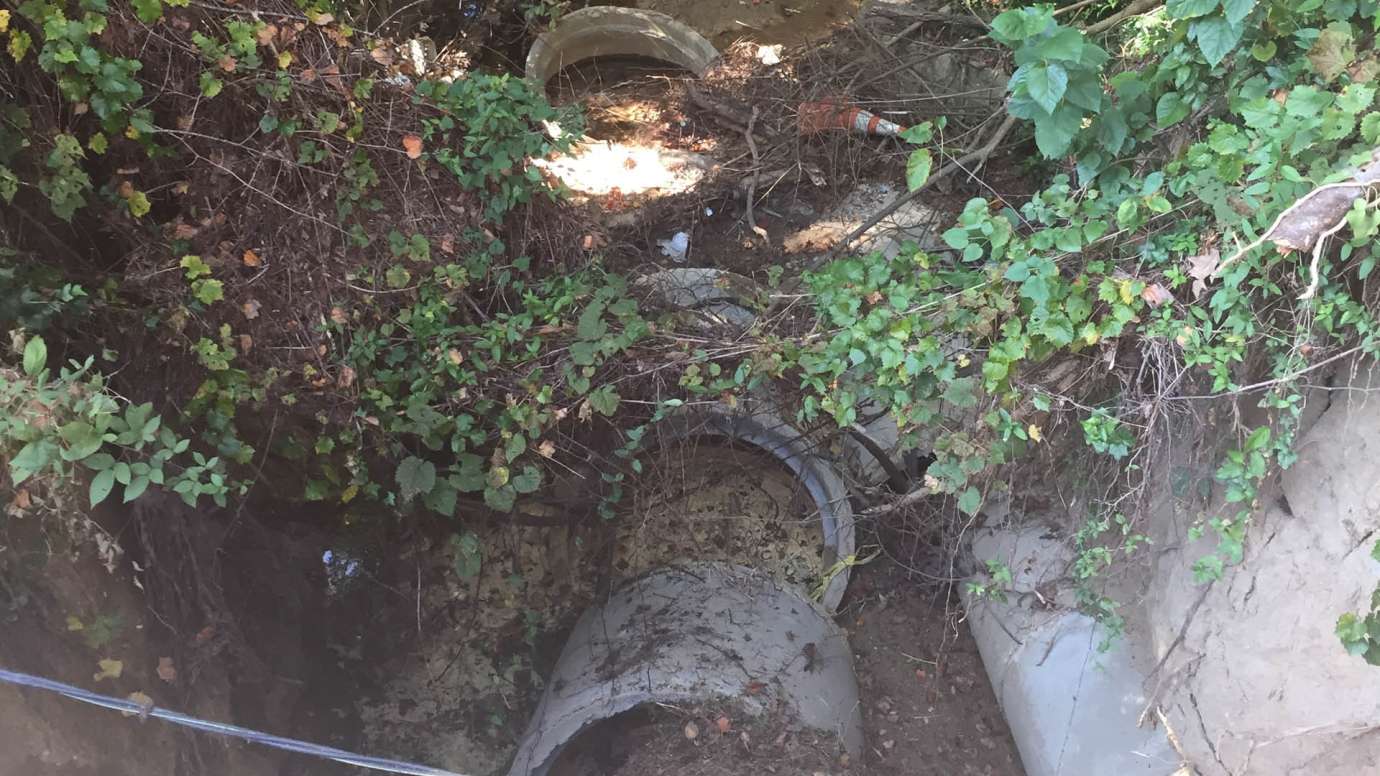 A round, concrete stormwater pipe damaged on Galahad Drive