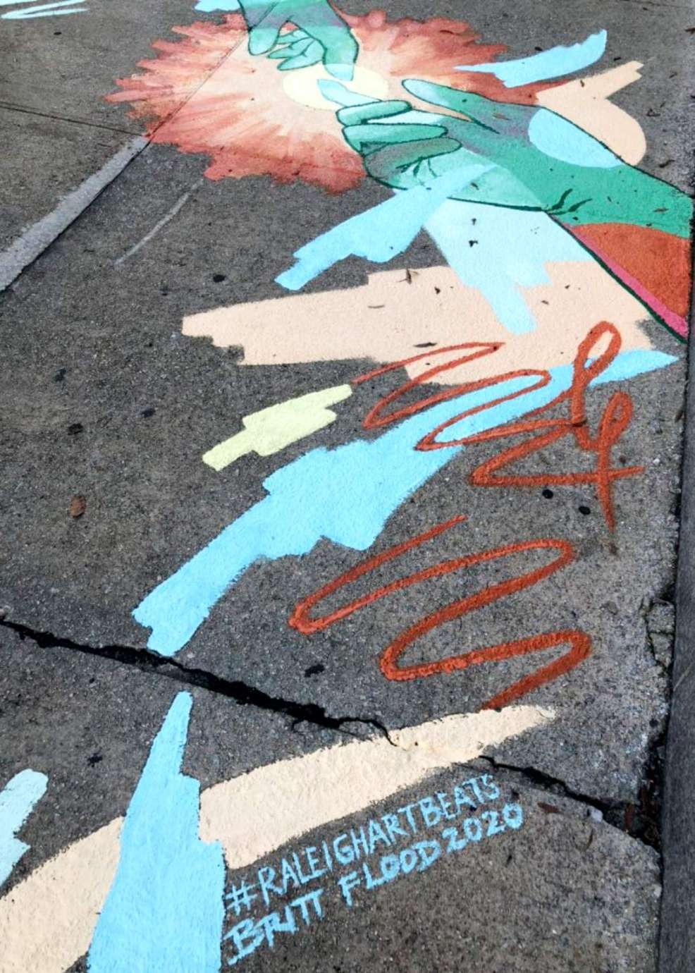 Sidewalk mural by artist Britt Flood