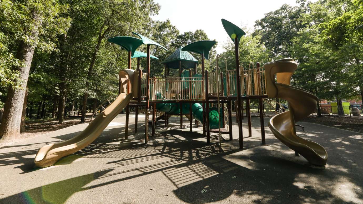 A second larger playground for older kids with more advanced equipment
