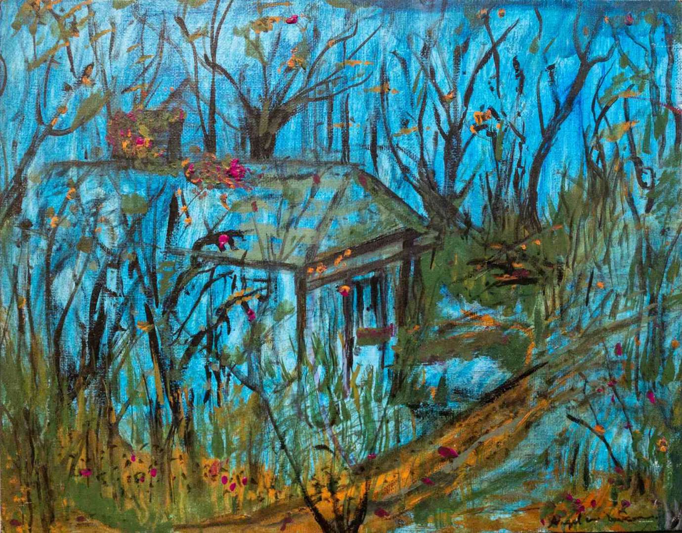 Blue house surrounded by trees with thin branches and few leaves