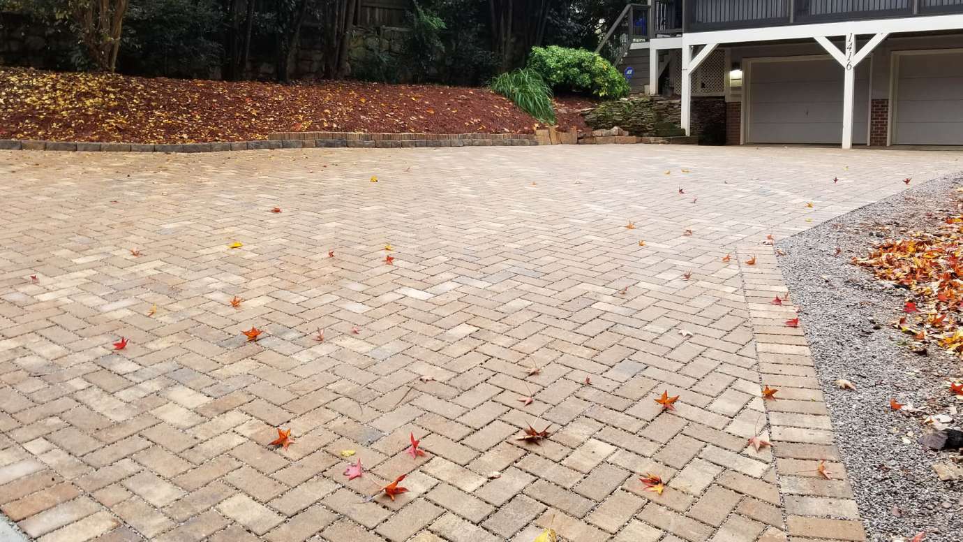A driveway with permeable pavement that soaks up water when it rains