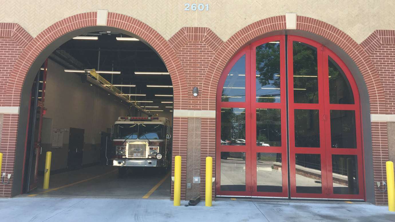 Red, rounded bay doors for Fire Station 6