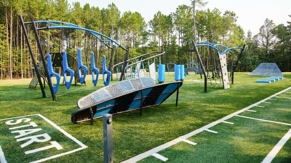 Challenge course equipment with "Start" in white letters on grass