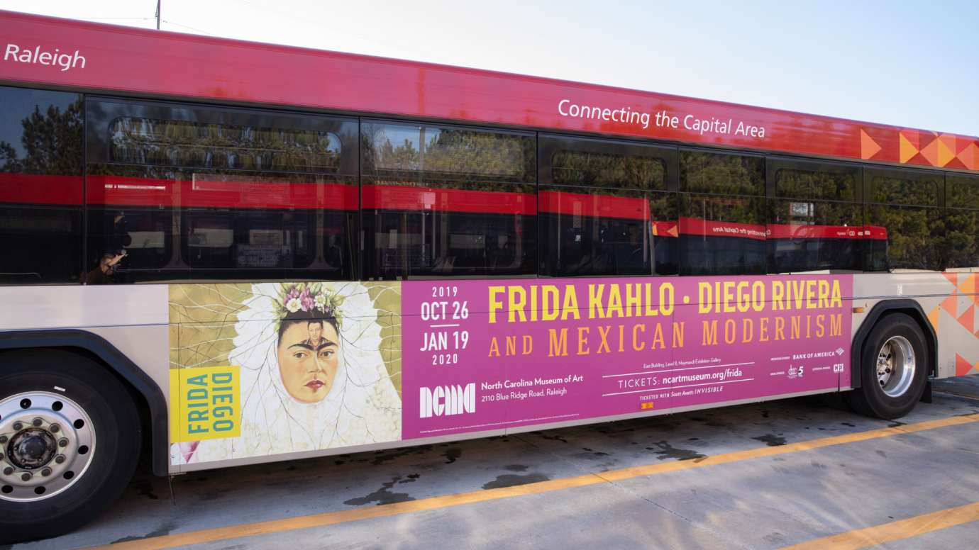 GoRaleigh bus with an ad for Frida Kahlo - Museum of Art Exhibit