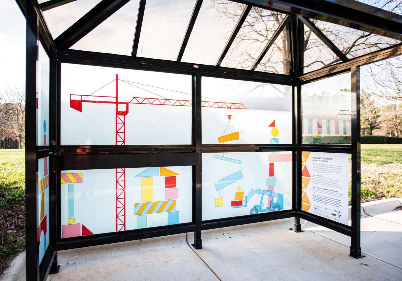 Artwork wrapped on bus shelter windows titled Building Together by  Becky Joye located at  Green Road at Brockton Drive, Green Road Library