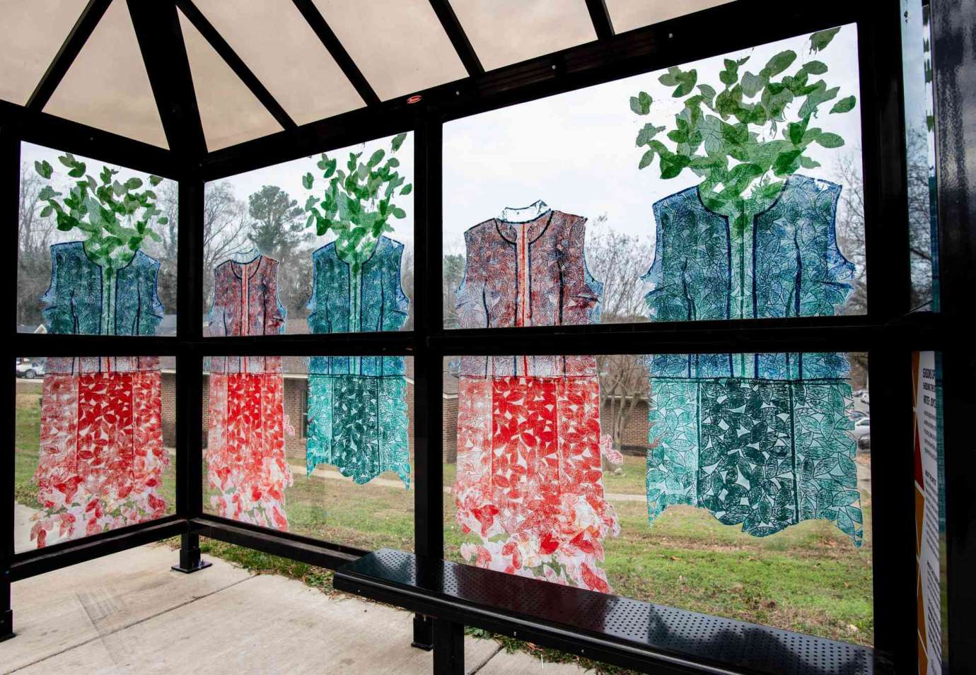 Artwork wrapped on bus shelter windows titled Seasons of Change and Hope: Shredding the Old and Growing the New  by Joyce Watkins King  located at Poole Road at Rawls Drive