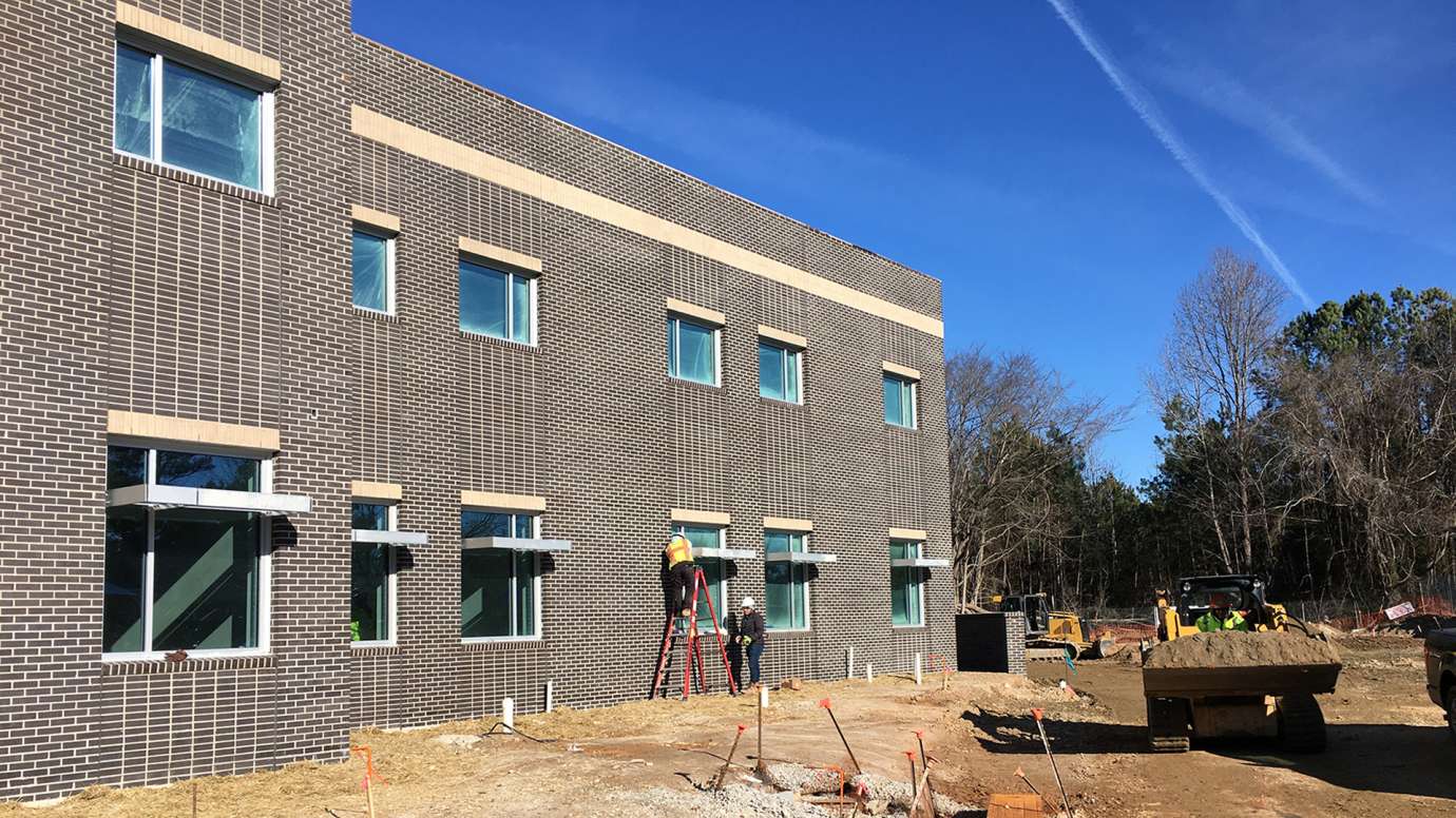 Fire Station 22 in construction , new windows added to front of building 