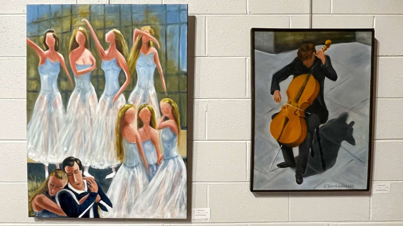 Paintings hang on the wall at Sertoma Arts Center