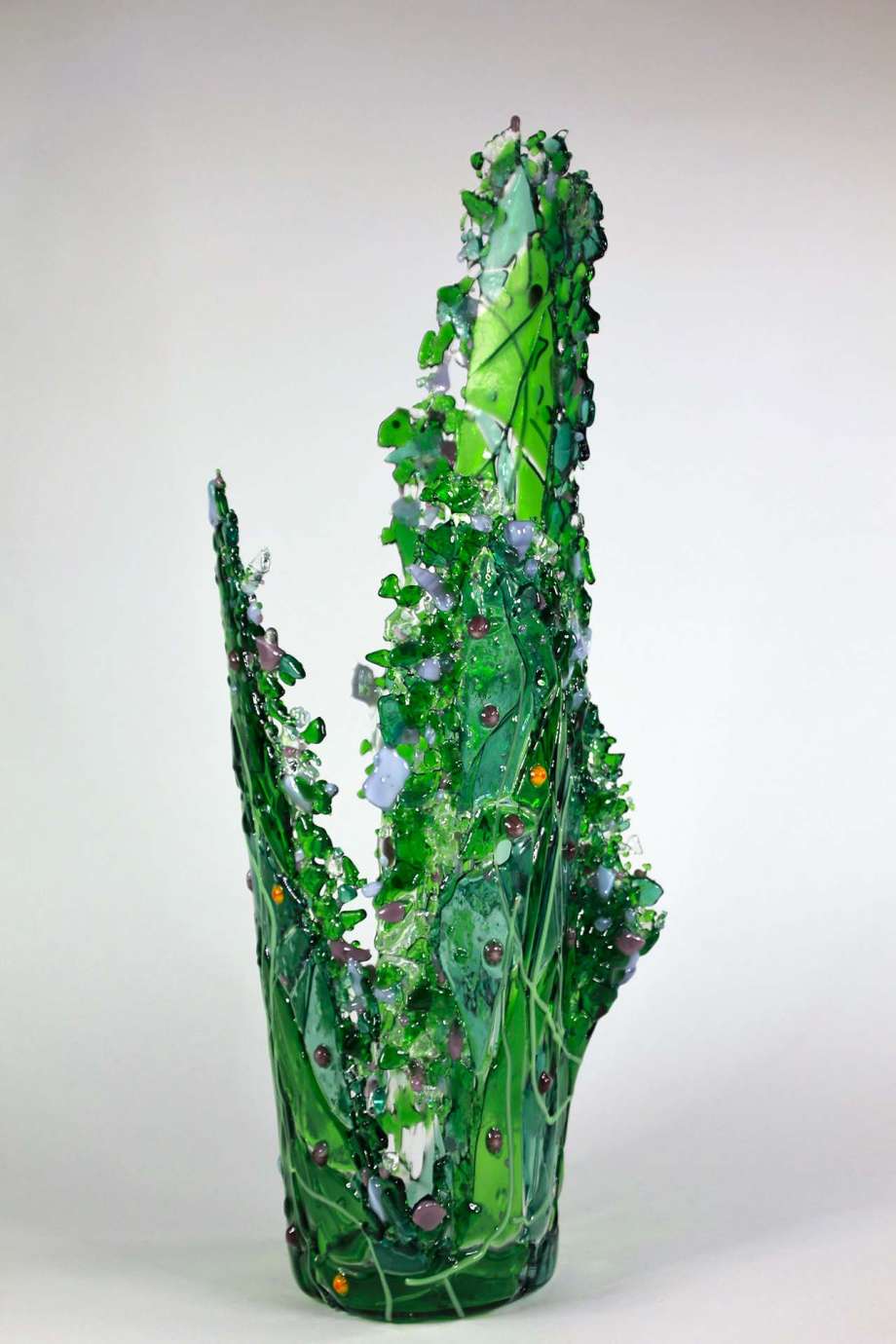 a tall, cactus-like, textured, dark green vase 