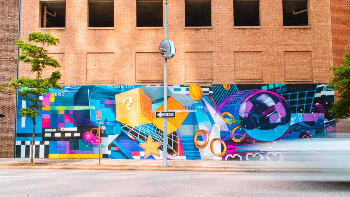 a mural of purple, blue and yellow representing the change in gaming technology