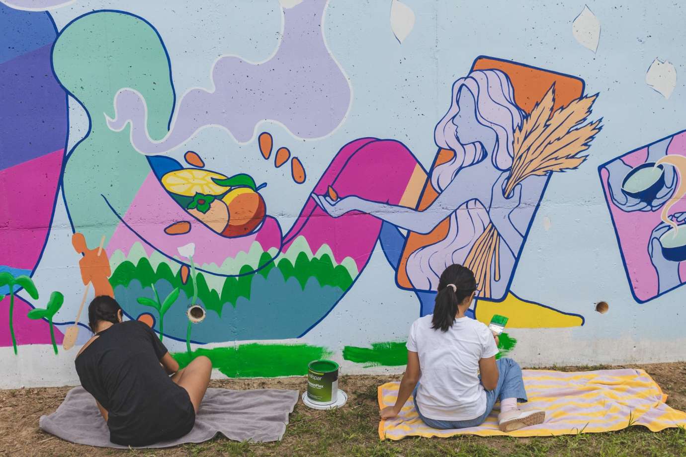 People painting a mural. 