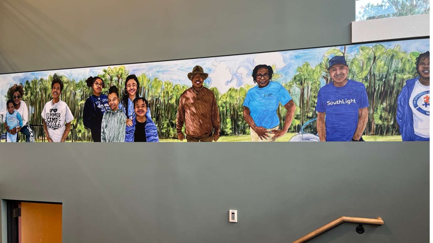 a painting of Barwell Road community members smiling