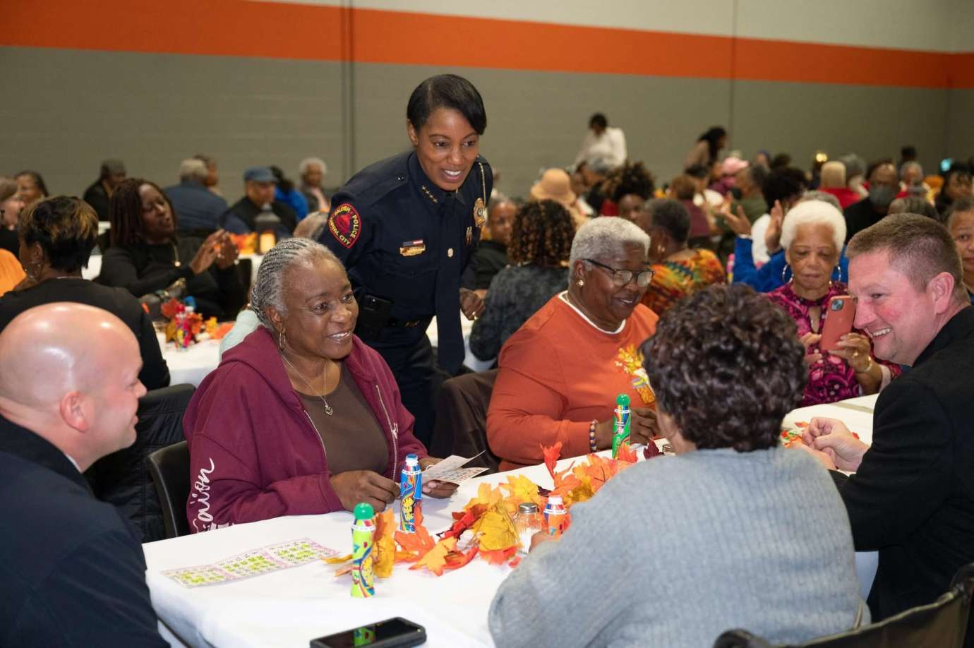 Chief Patterson speaks to a table of people