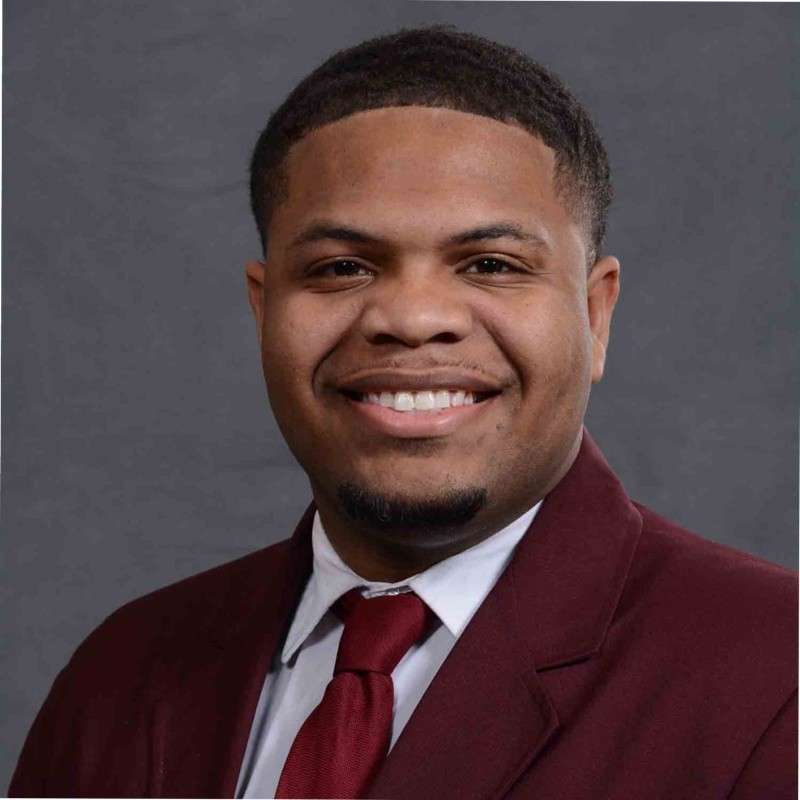 Young Black male poses for portrait