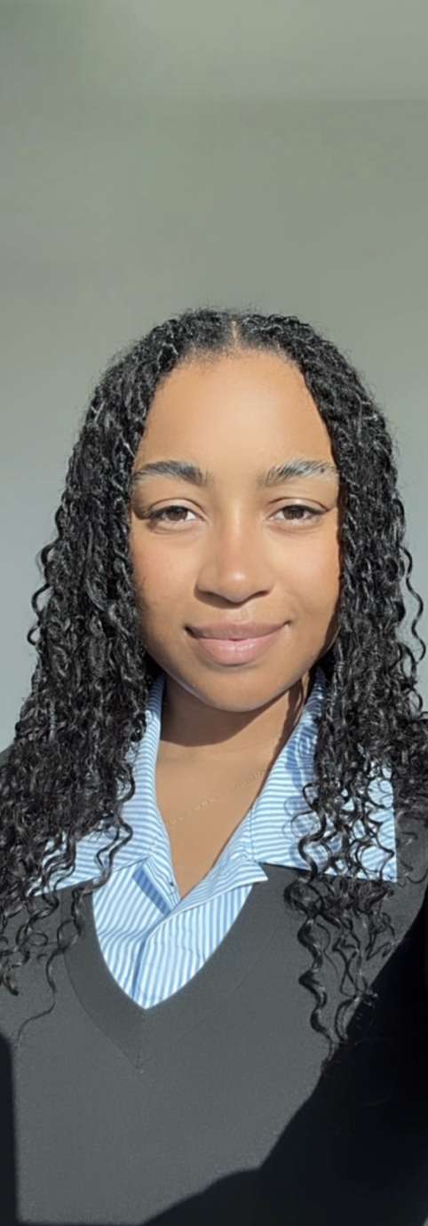 Young Black woman poses for portrait