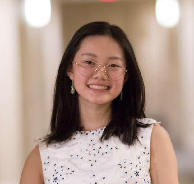 Young woman poses for portrait