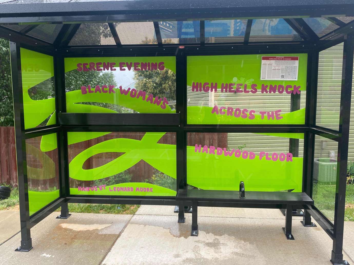Artwork and poetry installed behind bus shelter on the south side of Poole Road