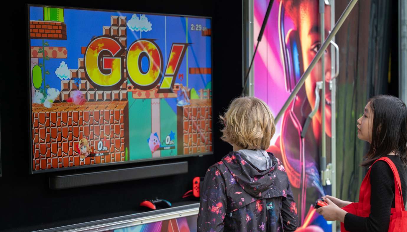 Kids playing Nintendo Outside