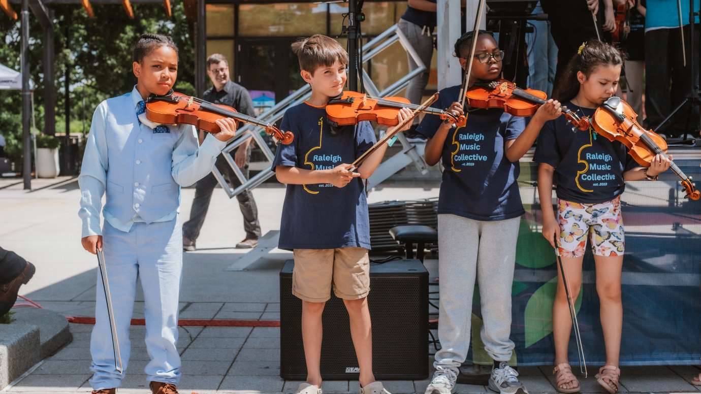 children playing violin