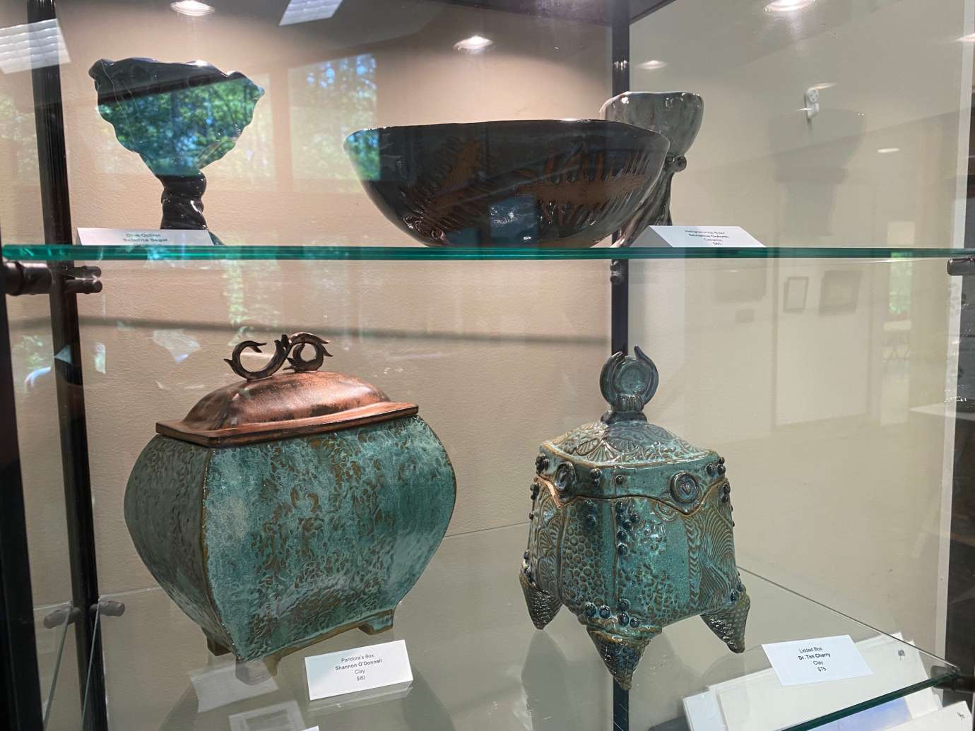 Pottery in a Glass Display Case 