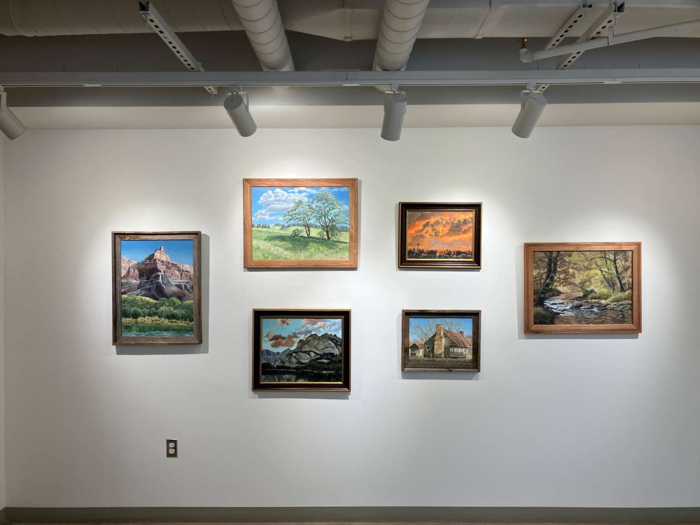 Gallery with artworks hung on the wall at Pullen Arts Center