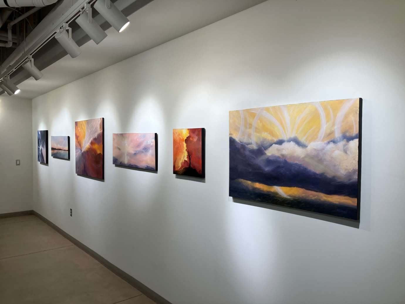 Gallery with artworks hung on the wall at Pullen Arts Center