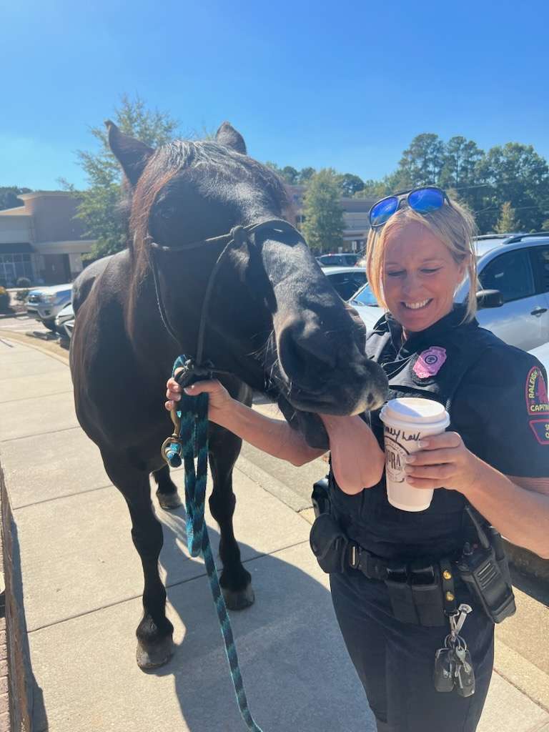 Willow licks Officer Montemurro's coffee