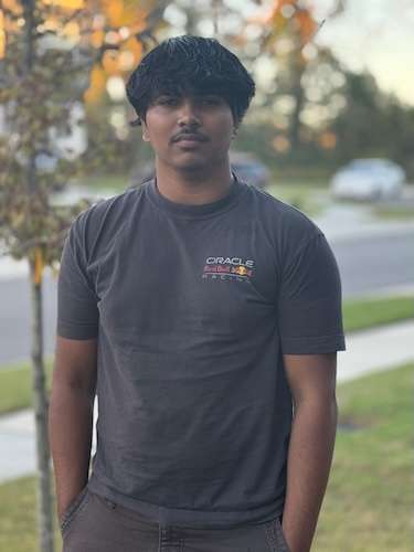 Headshot of Nithinram Mahalingamt wearing a t-shirt standing outdoors