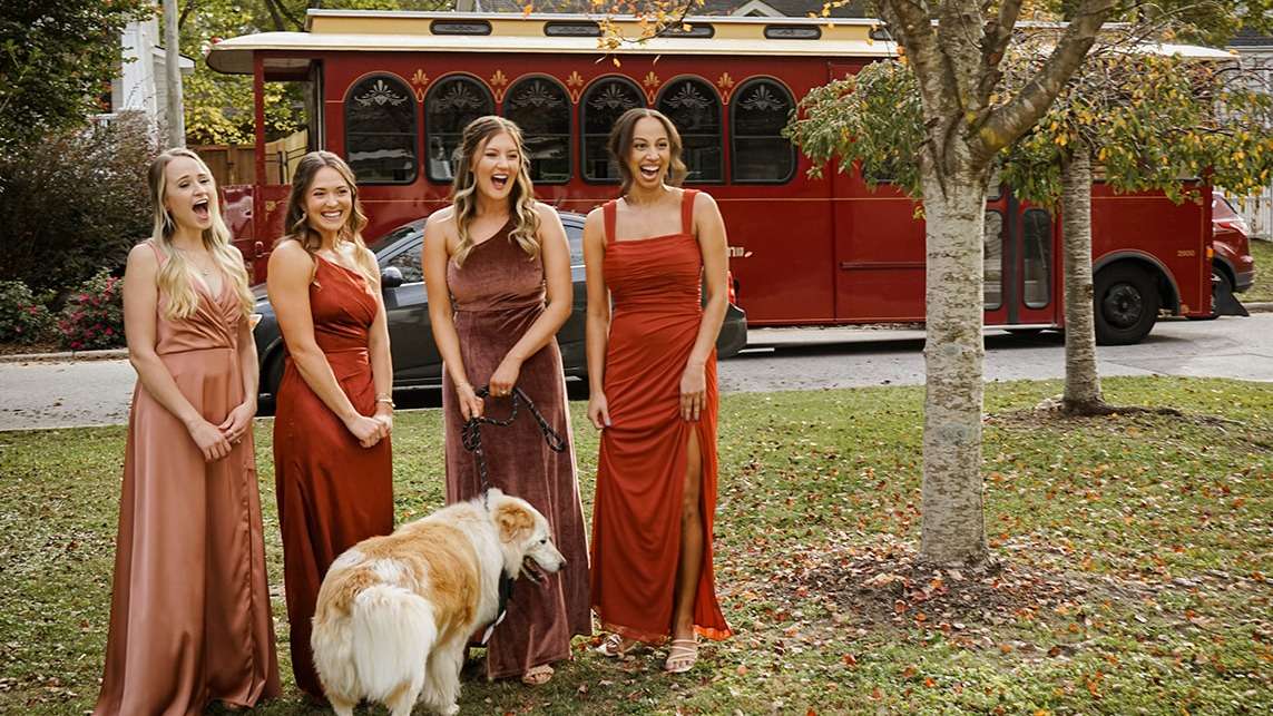 raleigh trolley with wedding party and dog