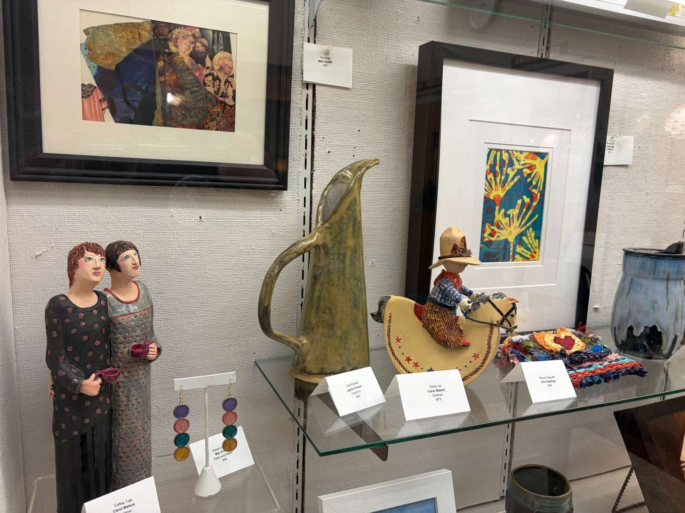 2D and 3D Artwork in a display case 