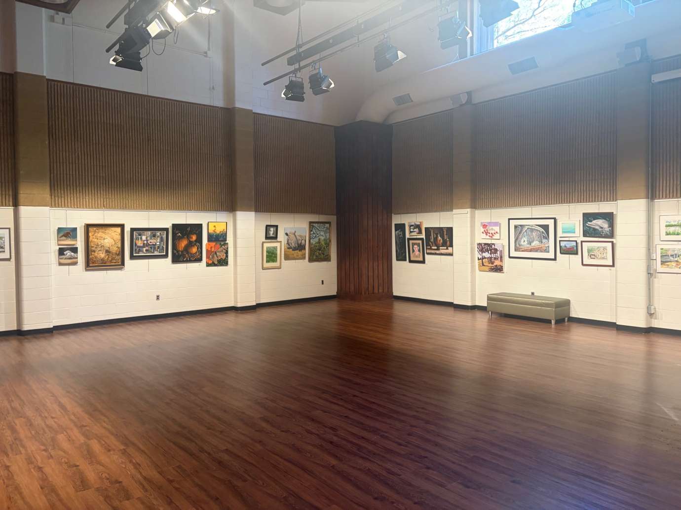 2D Mixed Media Artwork hanging on a white wall in a large room with a wood floor