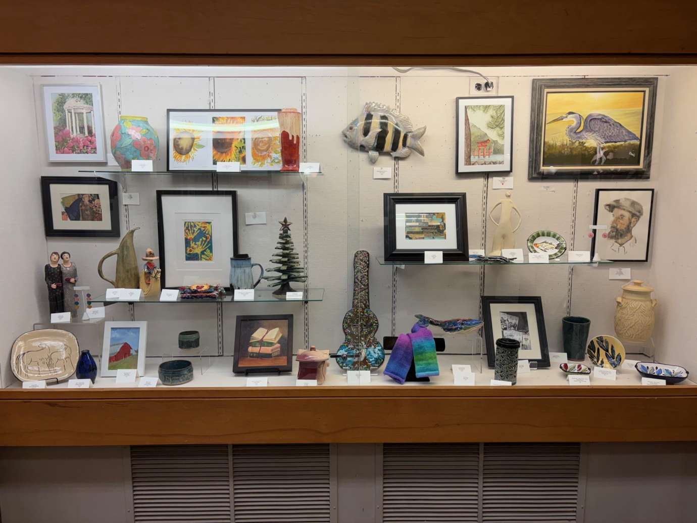 2D and 3D Artwork in a display case 