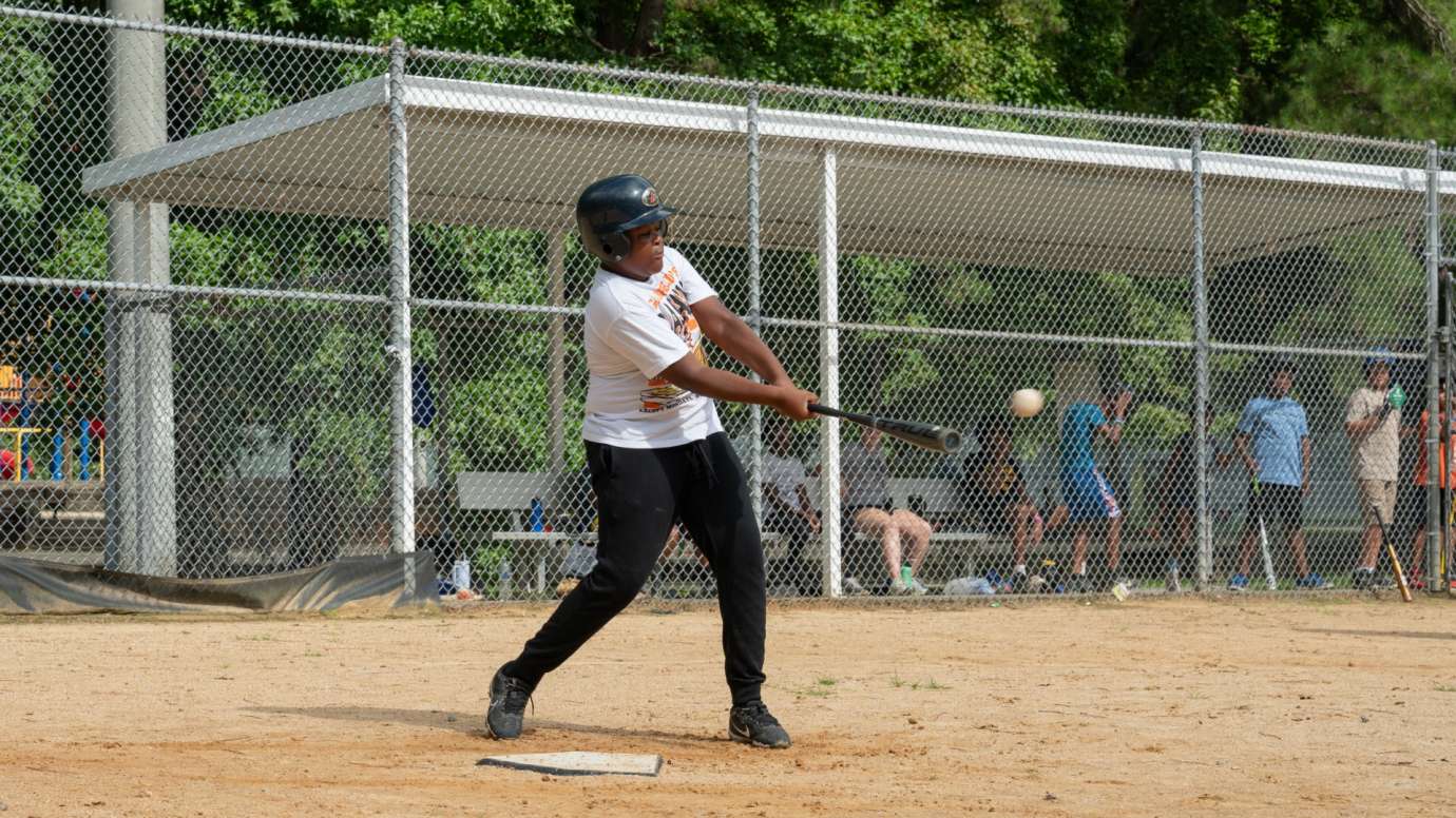 Baseball hitter swinging bat