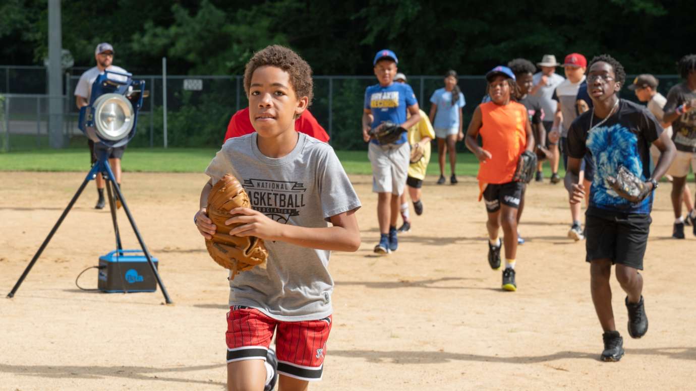 Baseball players running with gloves