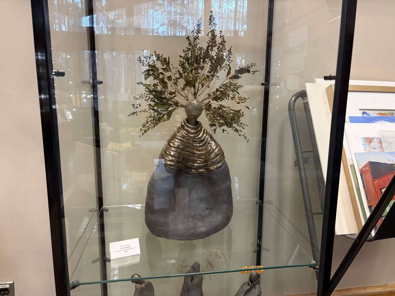 Ceramic Sculpture by Irena Cepulyte in a glass case 