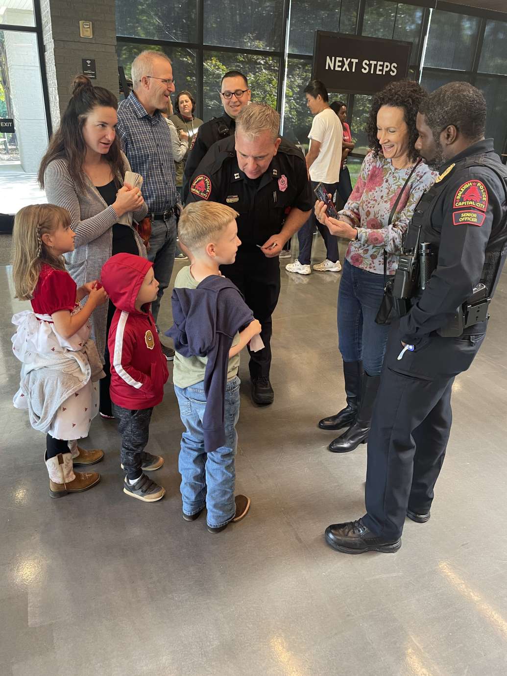 RPD officer speaking to group of young children