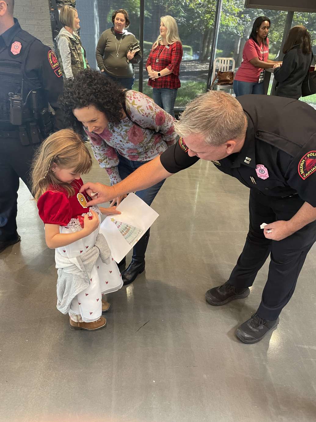 RPD officer greeting young child