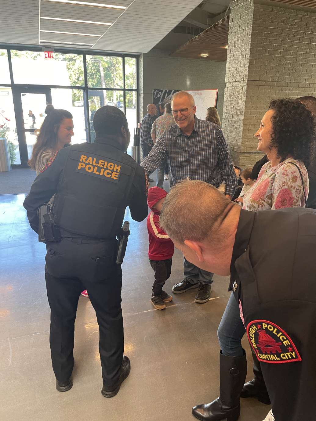 RPD officer shaking hand with person