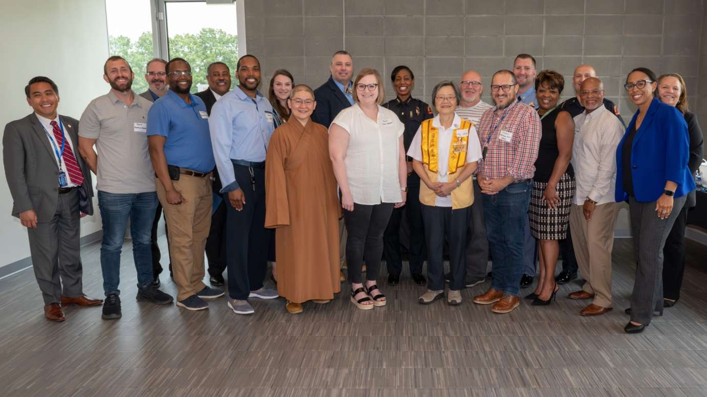 Group photo of people standing in two rows