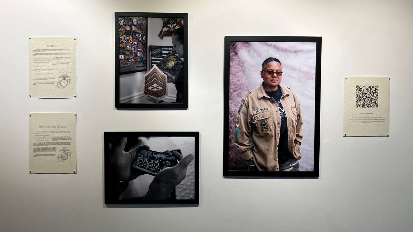 Installation of Don't Ask Don't Tell exhibit featuring portrait photos and written statements at Pullen Arts Center