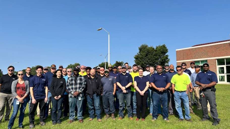 staff stands outside of Neuse River Resource Recovery building